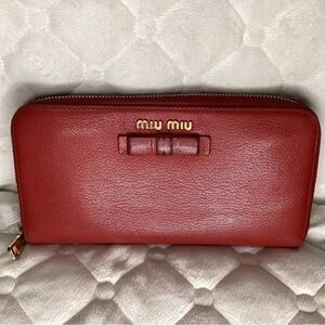 MIU MIU red leather zip around wallet with bow